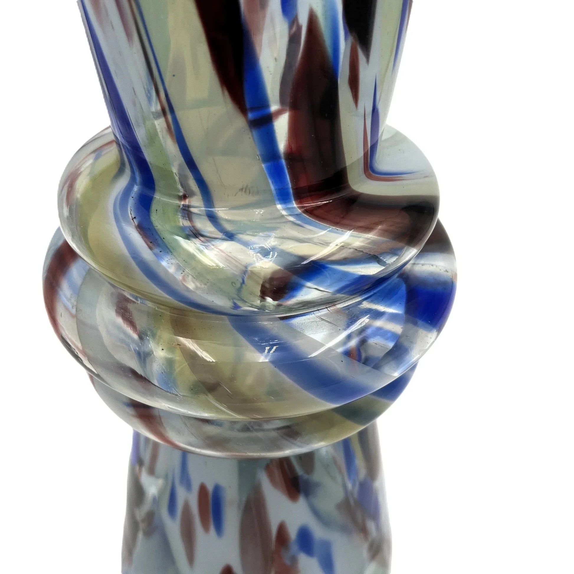 This mid-century Spatter or End of Day Vase.  It features a colorful "end of the day" or splatter design with blue, red, white, and black colours under clear glass.