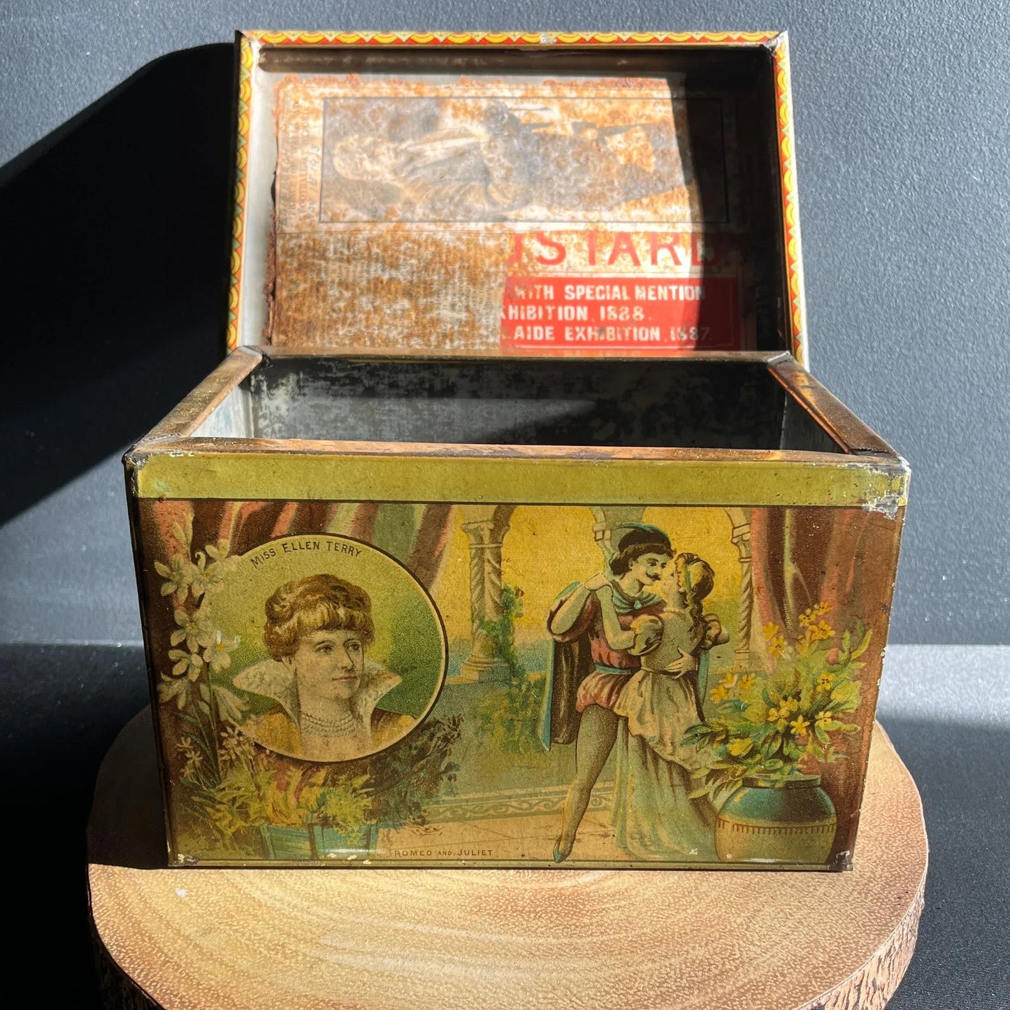 This is a Vintage early 1900s, Moss Rimmington and Co Mustart Tin, Selby Works, West Riding Mills. On the sides of the tin, there are lithographic images of plays and their characters.