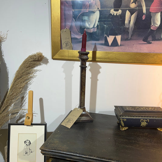 These are a heavy pair of cast metal candlesticks with a bronze or bronze coloured metal patina look. 