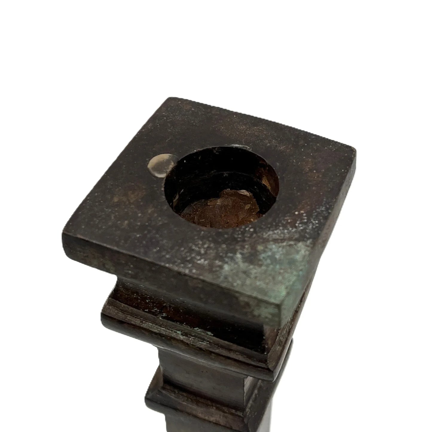 These are a heavy pair of cast metal candlesticks with a bronze or bronze coloured metal patina look. 