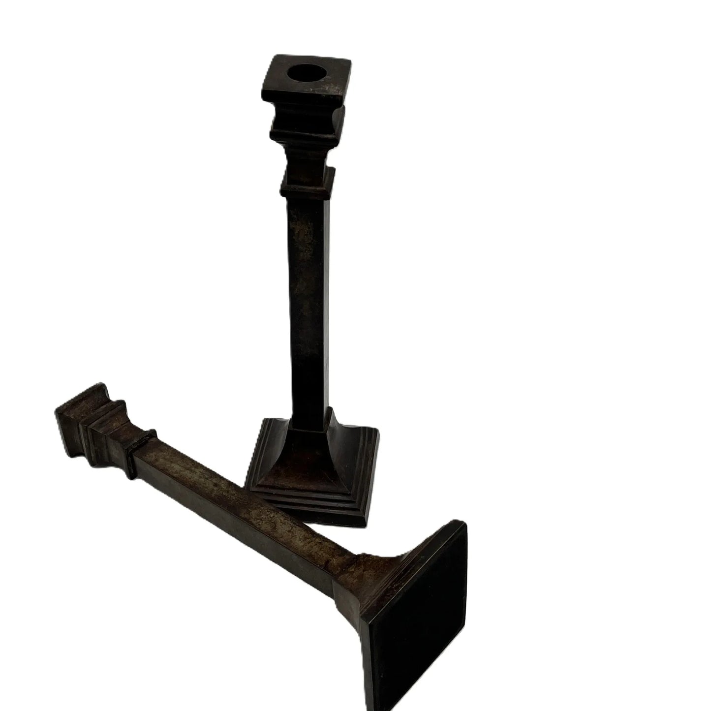 These are a heavy pair of cast metal candlesticks with a bronze or bronze coloured metal patina look. 
