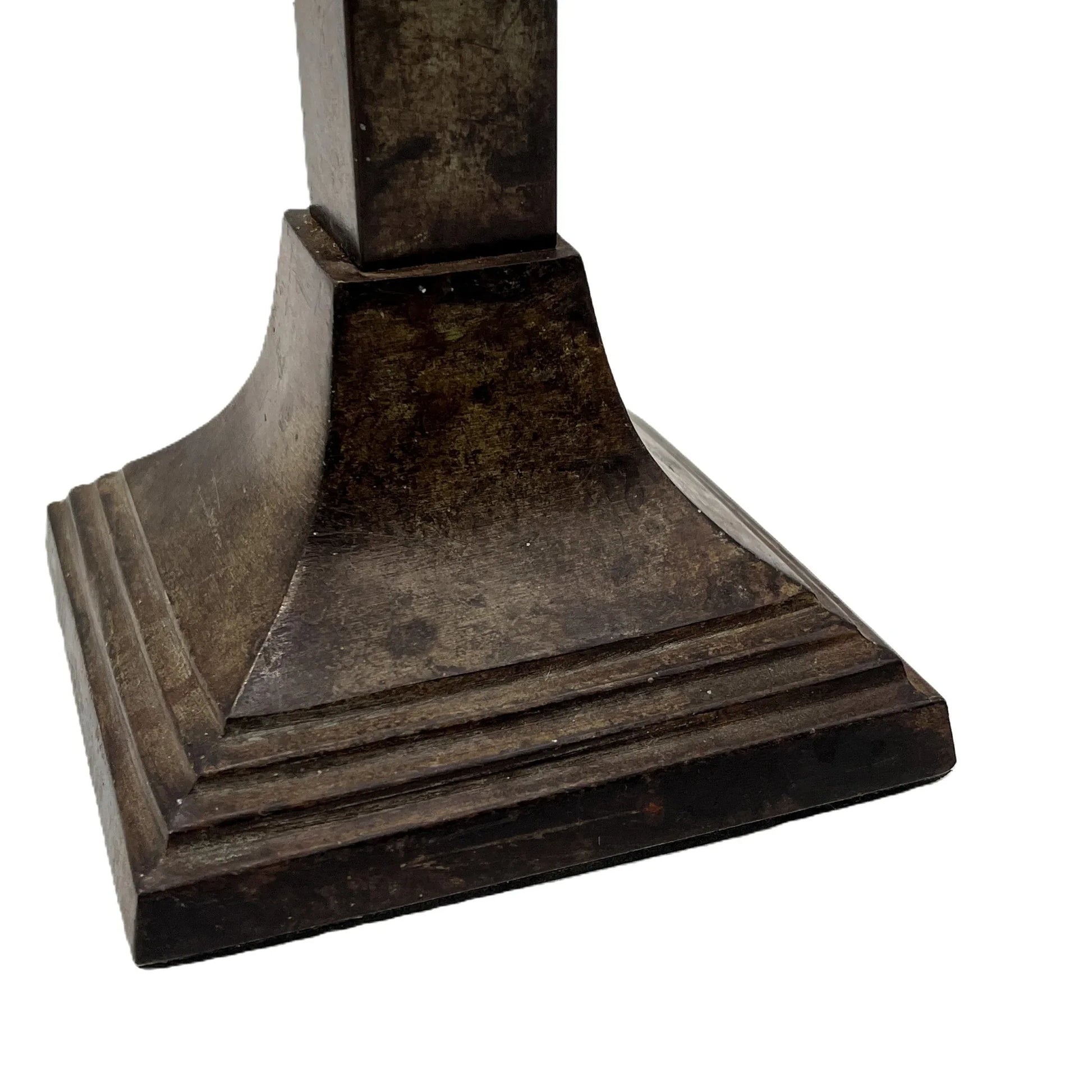 These are a heavy pair of cast metal candlesticks with a bronze or bronze coloured metal patina look. 