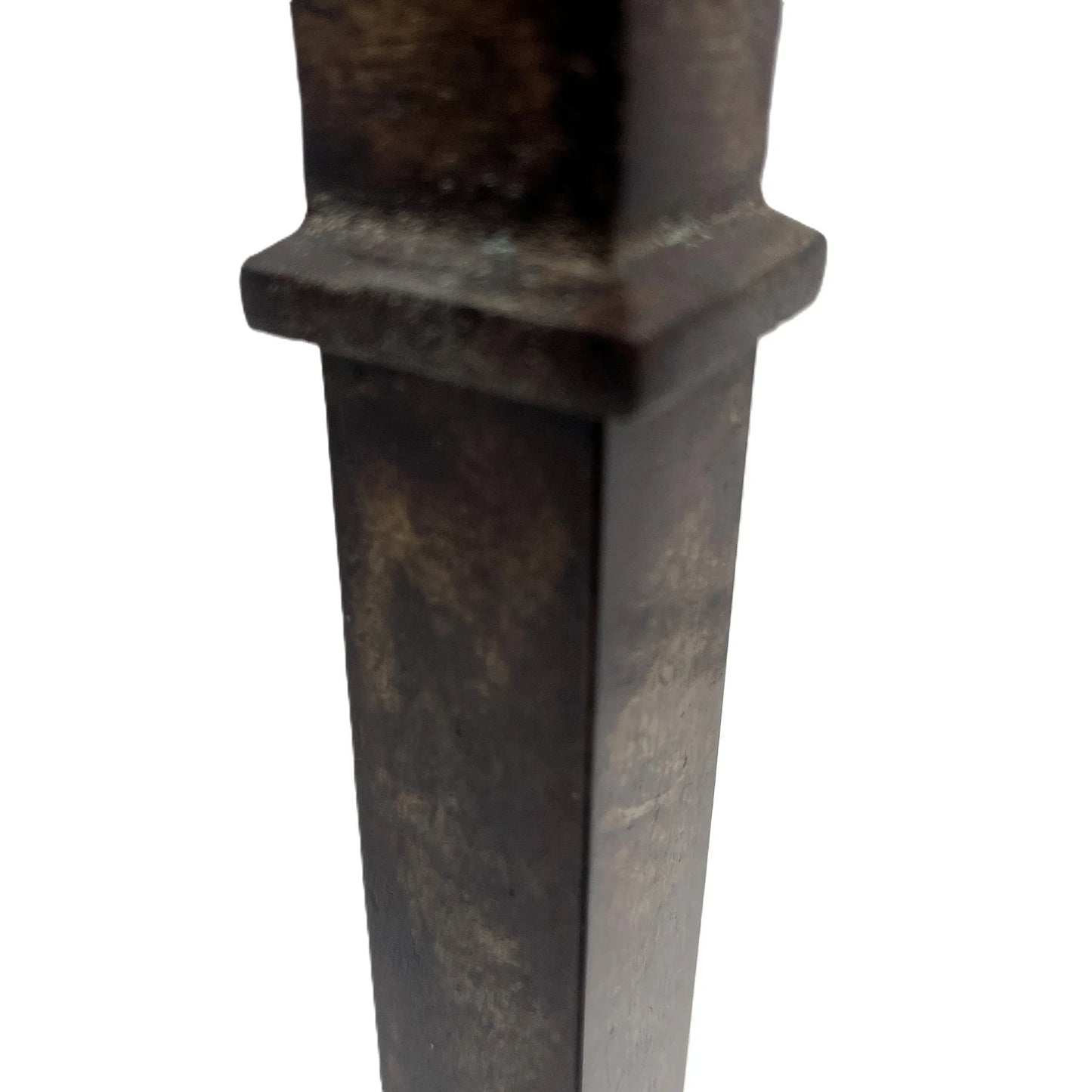 These are a heavy pair of cast metal candlesticks with a bronze or bronze coloured metal patina look. 