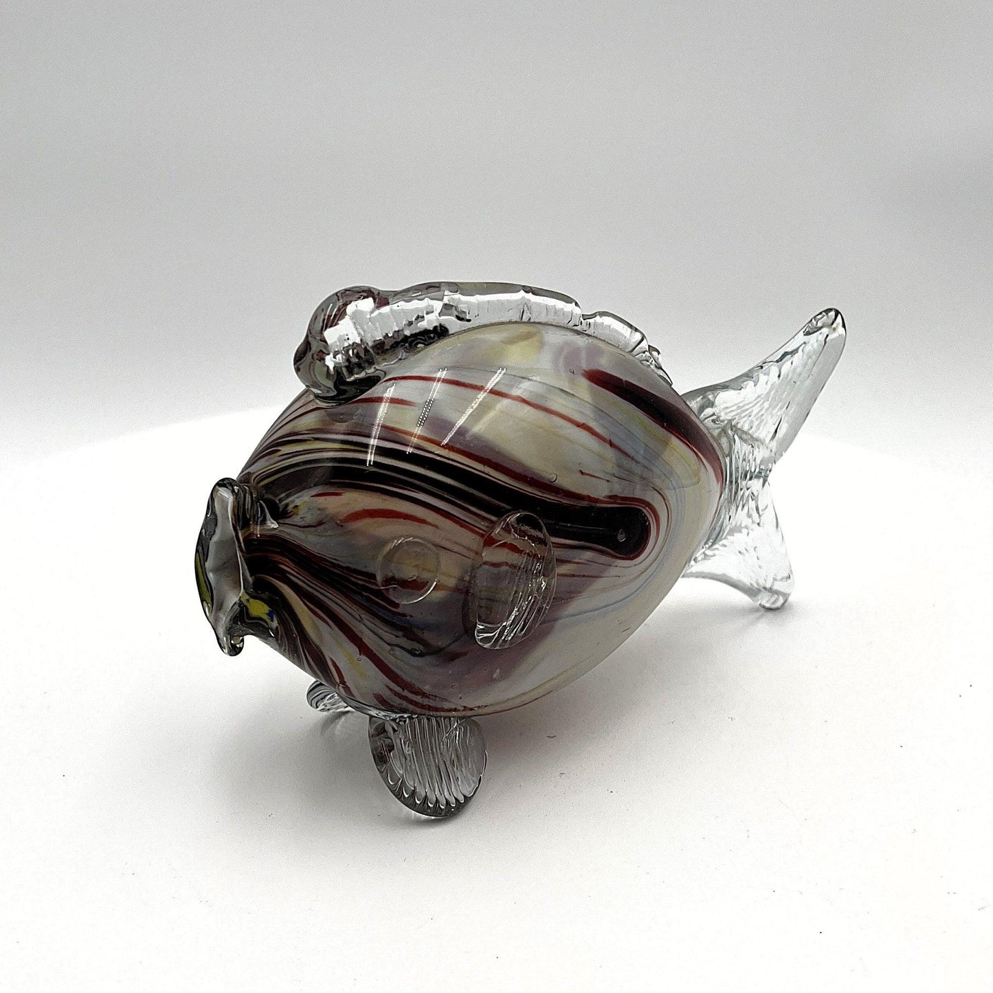 This is a pair of mid-century Spatter, End of Day, or marbled fish.  They feature a colourful marbled design with clear glass fins.