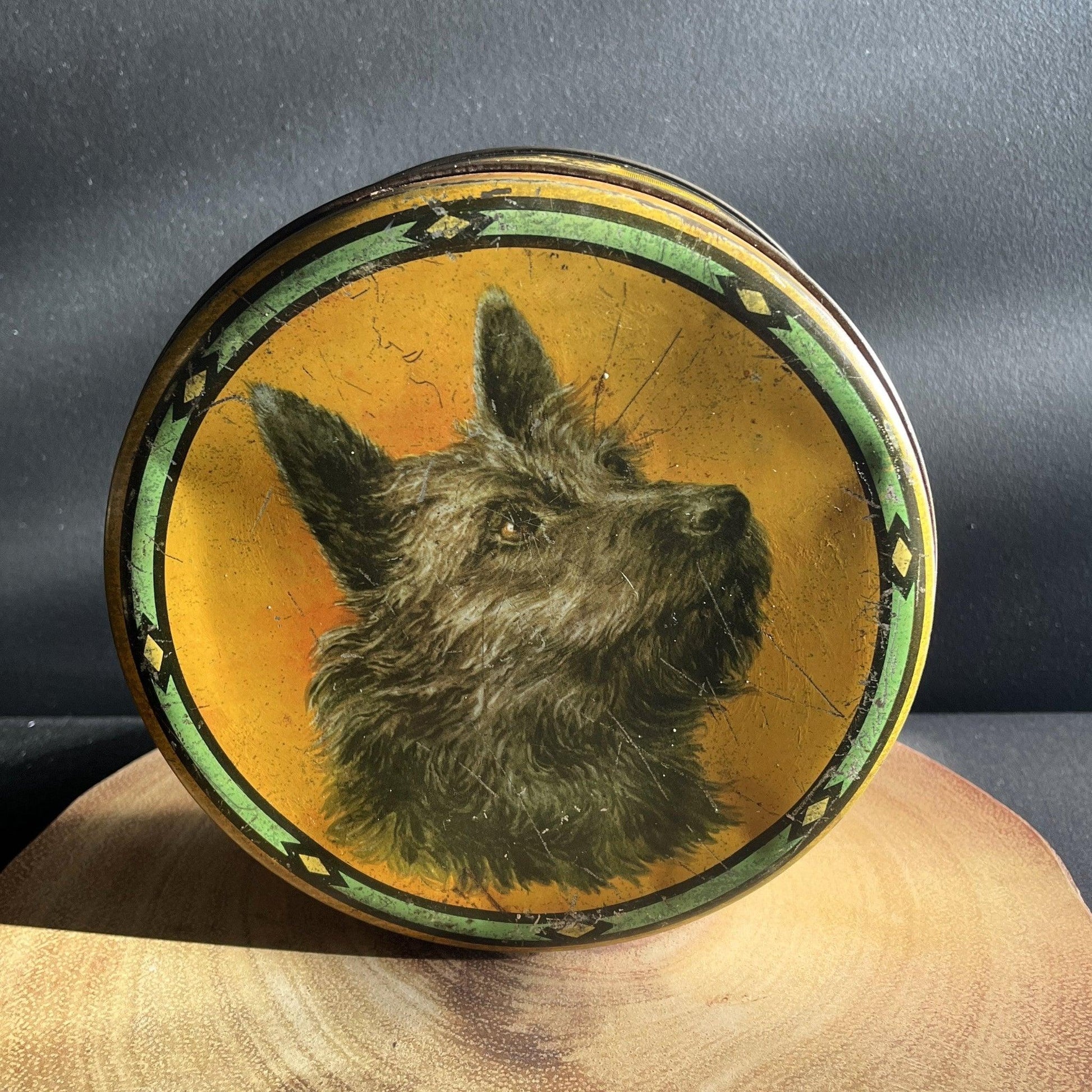 This is a smaller Pictorial Dog Mackintosh's Keillers Vintage Advertising toffee tin. It has a lovely picture of a Terrier on the lid and an assortment of dog breeds depicted around the sides of the tin.