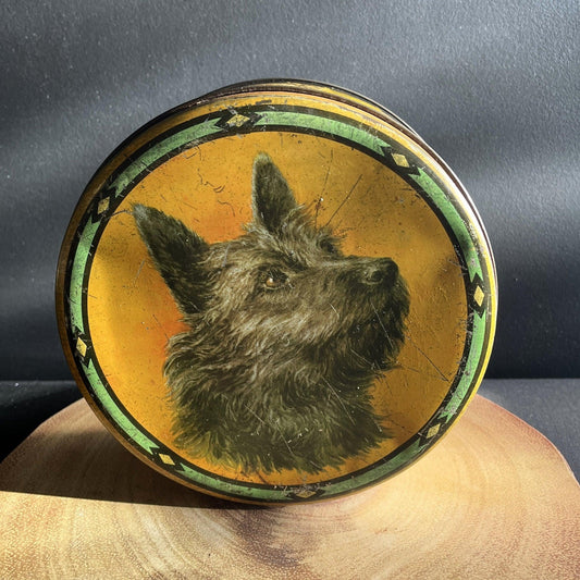 This is a smaller Pictorial Dog Mackintosh's Keillers Vintage Advertising toffee tin. It has a lovely picture of a Terrier on the lid and an assortment of dog breeds depicted around the sides of the tin.