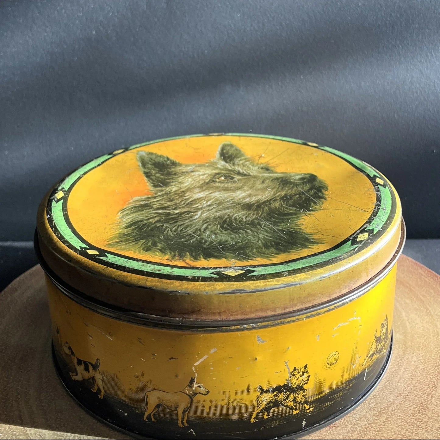 This is a smaller Pictorial Dog Mackintosh's Keillers Vintage Advertising toffee tin. It has a lovely picture of a Terrier on the lid and an assortment of dog breeds depicted around the sides of the tin.