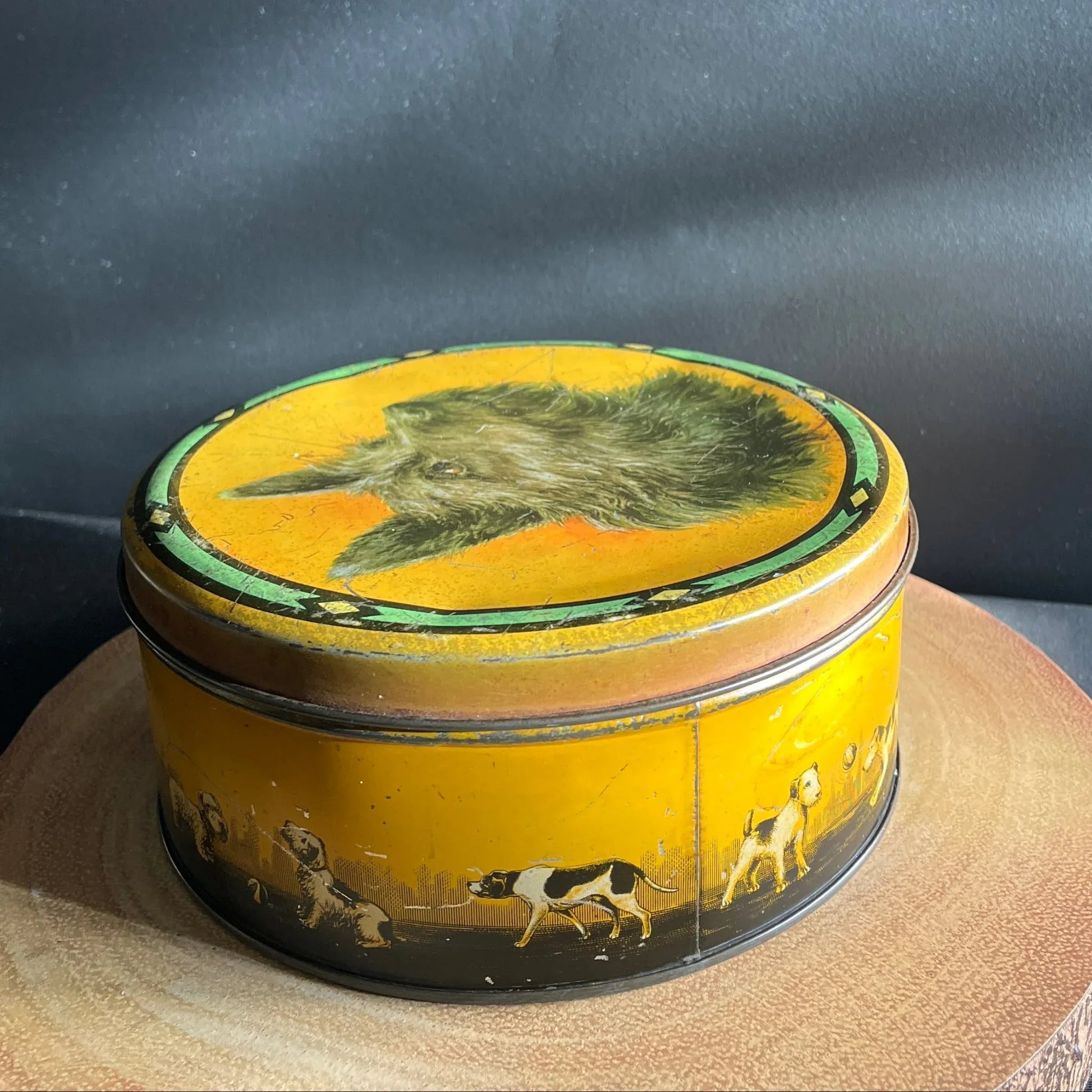 This is a smaller Pictorial Dog Mackintosh's Keillers Vintage Advertising toffee tin. It has a lovely picture of a Terrier on the lid and an assortment of dog breeds depicted around the sides of the tin.