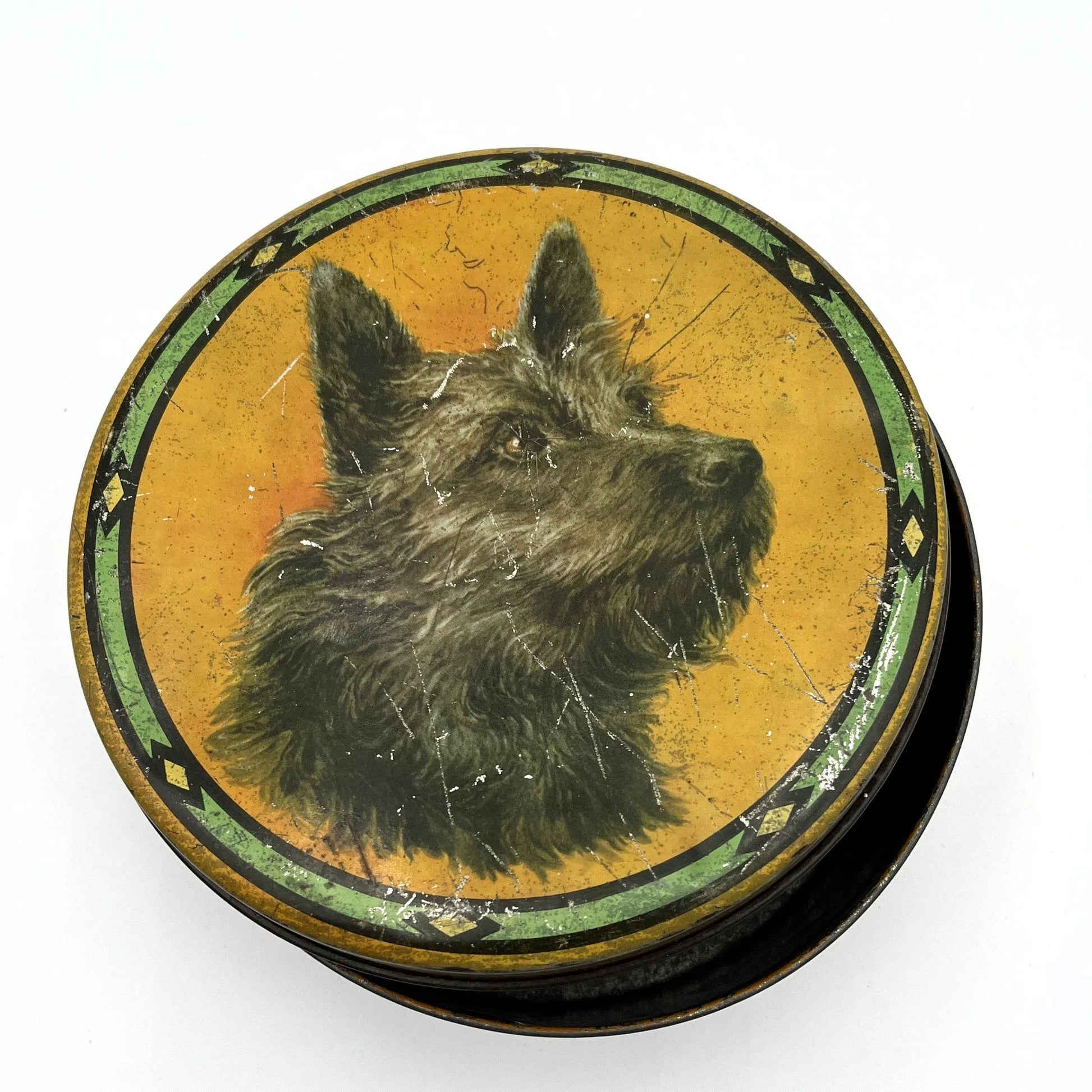This is a smaller Pictorial Dog Mackintosh's Keillers Vintage Advertising toffee tin. It has a lovely picture of a Terrier on the lid and an assortment of dog breeds depicted around the sides of the tin.