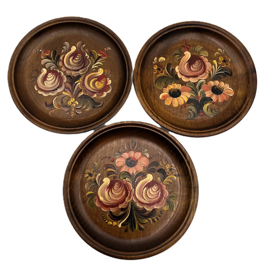 These are a set of 3 Vintage Wooden Hand Painted Decorative wall plates. Painted, I believe in a Norwegian Style with multicolour flower designs, 