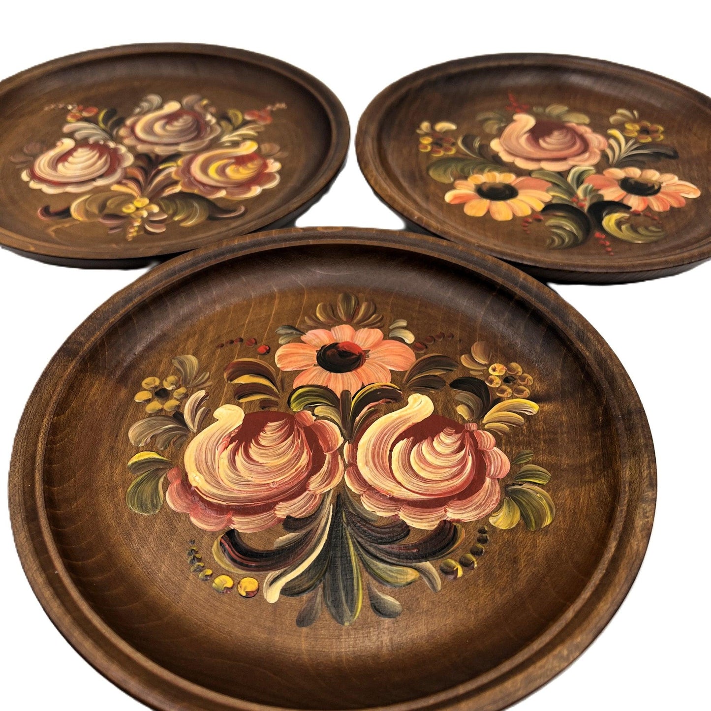 These are a set of 3 Vintage Wooden Hand Painted Decorative wall plates. Painted, I believe in a Norwegian Style with multicolour flower designs, 