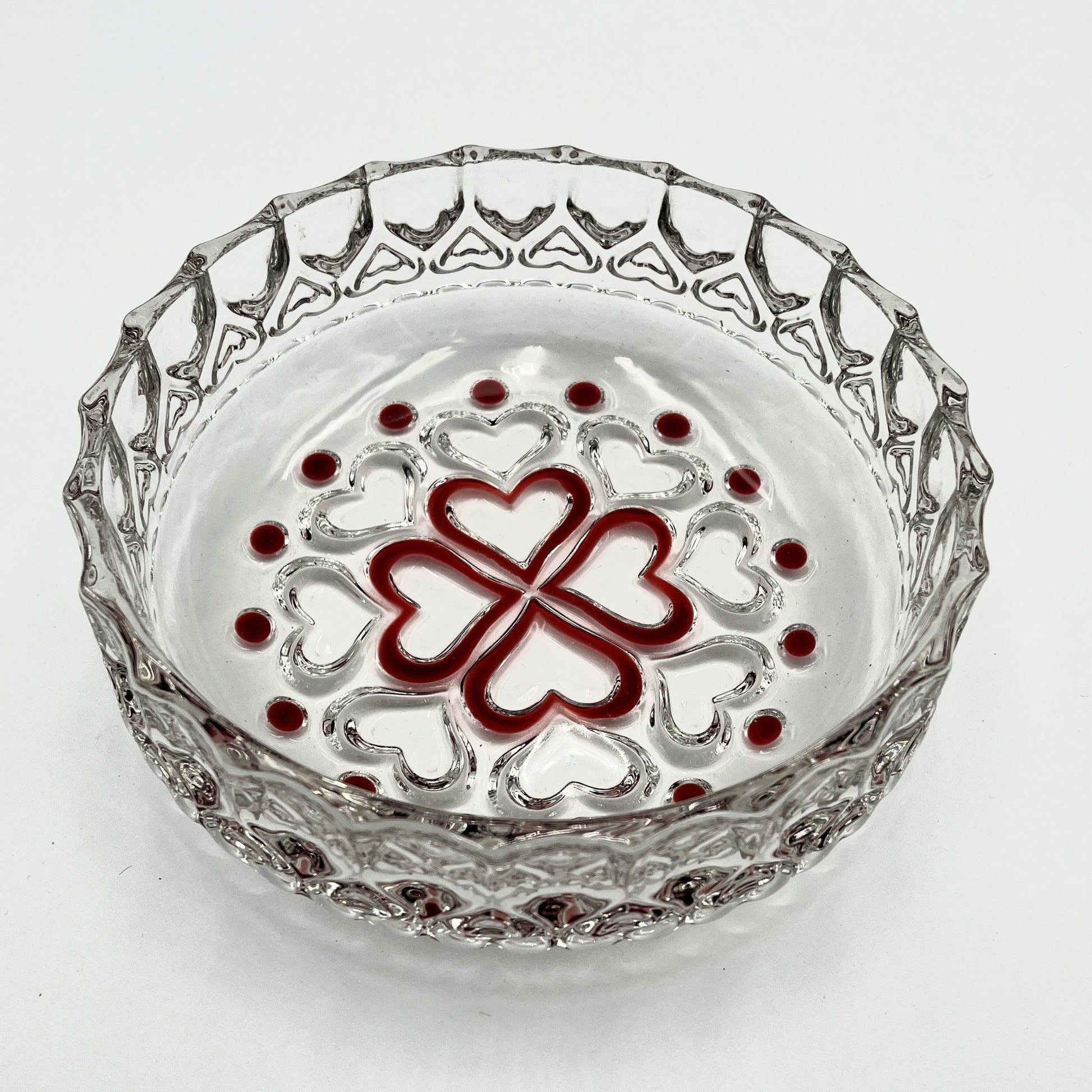 This is a vintage Walther Glas "Sweetheart" design serving bowl with a red heart and dot pattern. It is a round, clear glass bowl with a crimped edge and heart pattern design.