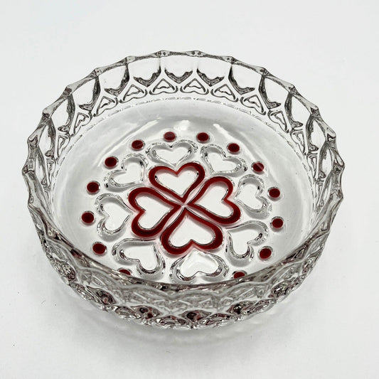 This is a vintage Walther Glas "Sweetheart" design serving bowl with a red heart and dot pattern. It is a round, clear glass bowl with a crimped edge and heart pattern design.