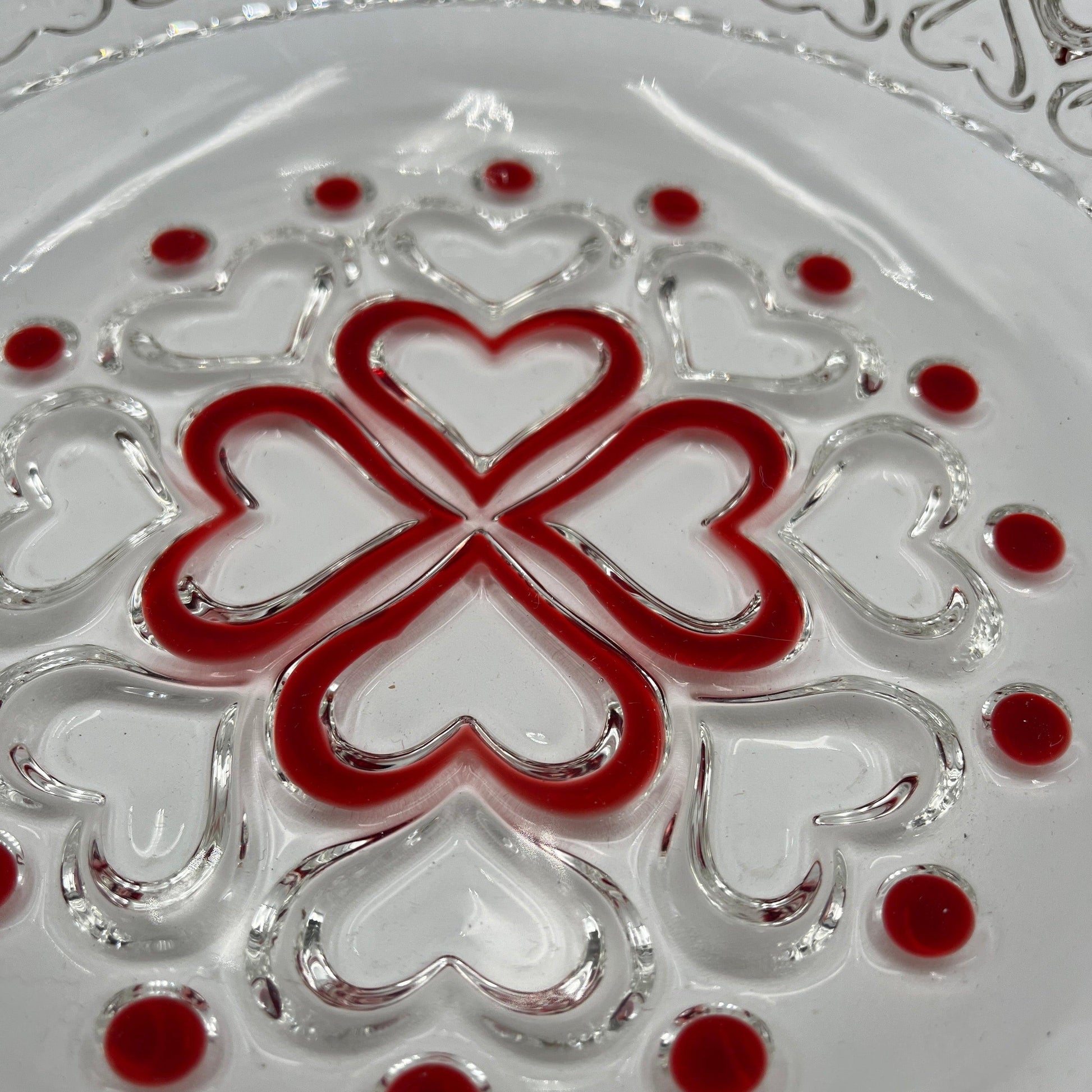 This is a vintage Walther Glas "Sweetheart" design serving bowl with a red heart and dot pattern. It is a round, clear glass bowl with a crimped edge and heart pattern design.