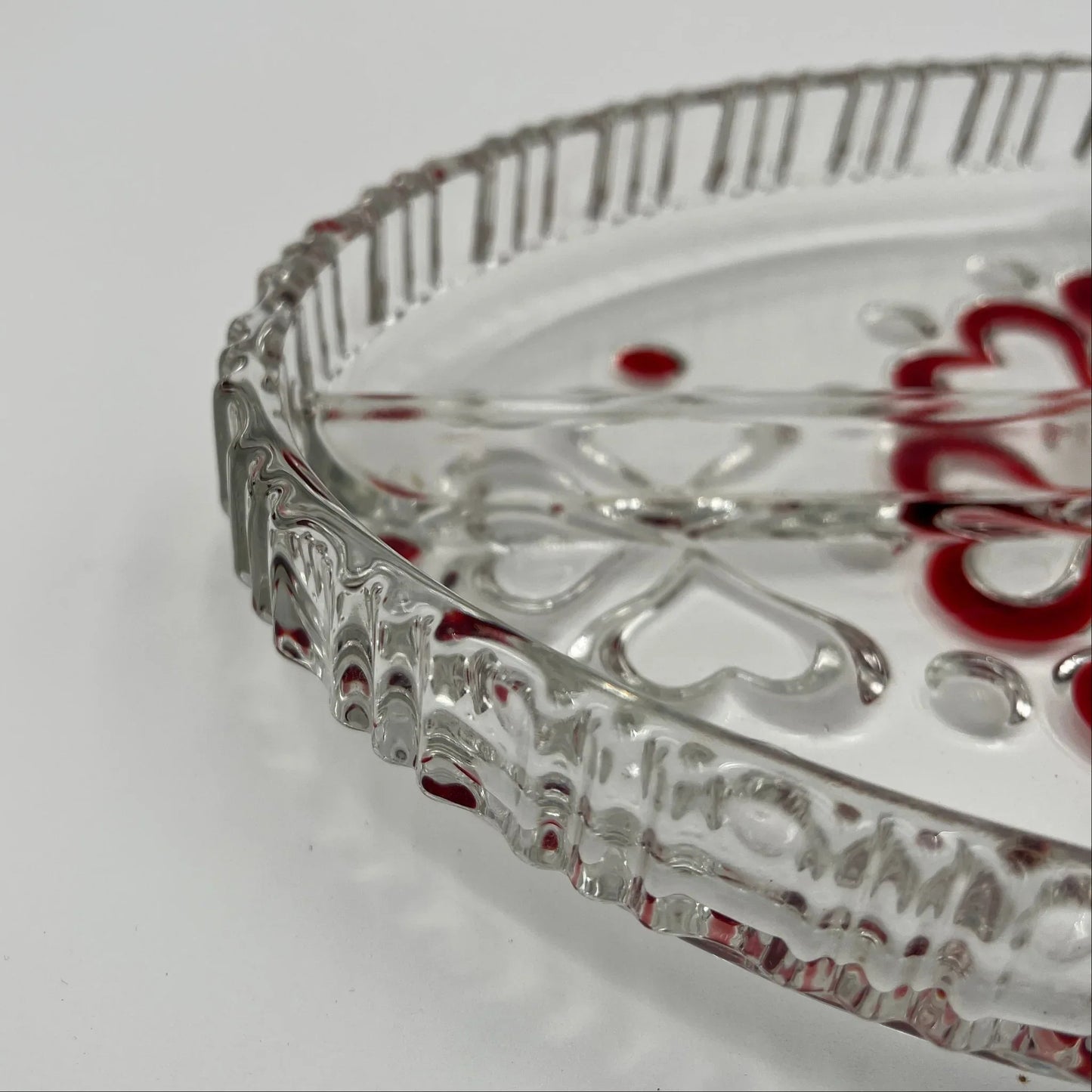 This is a vintage Walther Glas "Sweetheart" serving bowl, designed as a snack or sweets dish with a red heart and dot pattern. It is an oval, clear glass divided serving dish with a crimped edge.

