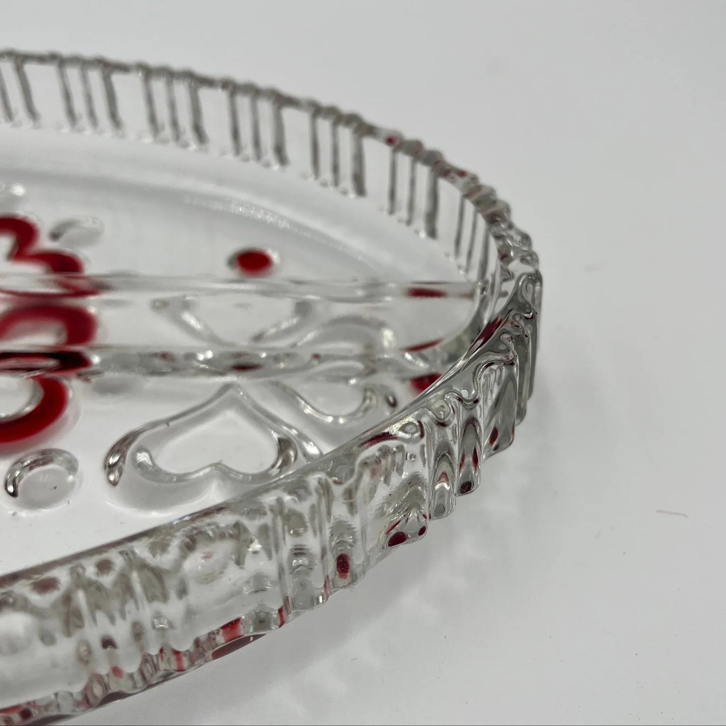 This is a vintage Walther Glas "Sweetheart" serving bowl, designed as a snack or sweets dish with a red heart and dot pattern. It is an oval, clear glass divided serving dish with a crimped edge.

