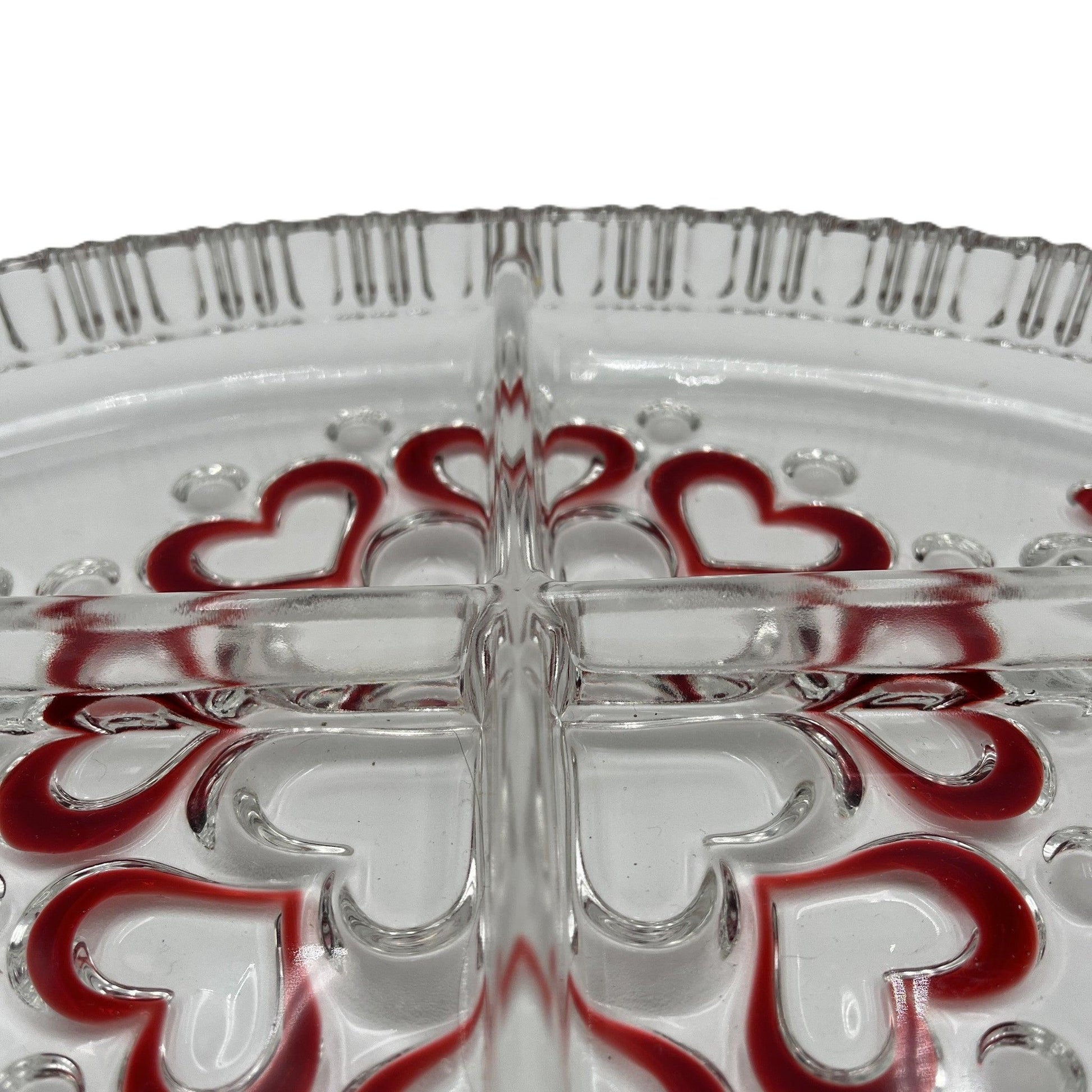 This is a vintage Walther Glas "Sweetheart" serving bowl, designed as a snack or sweets dish with a red heart and dot pattern. It is an oval, clear glass divided serving dish with a crimped edge.


