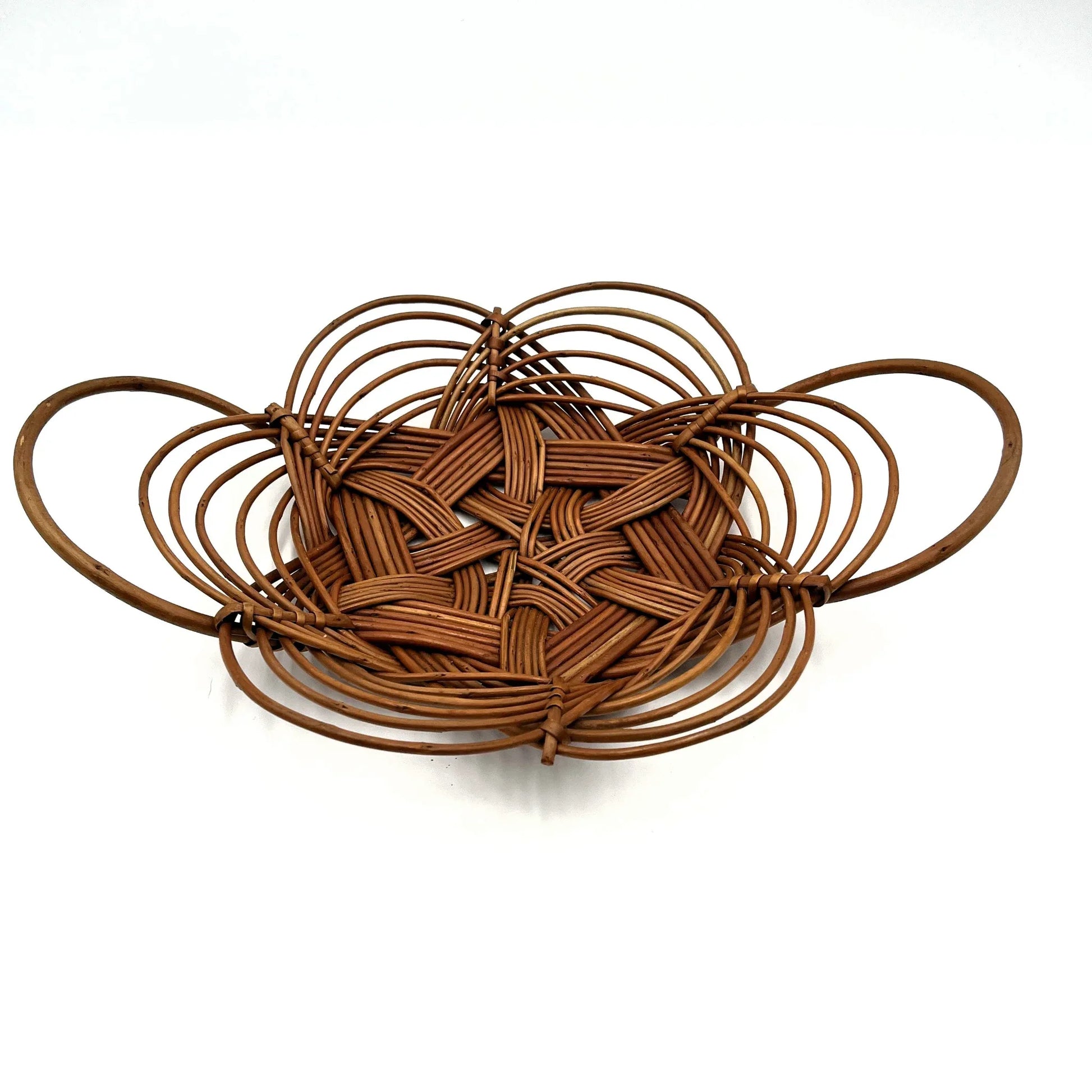 This is a vintage bread or fruit basket with a Celtic knot weave pattern. 
It is a decorative wicker or willow basket often used for serving bread or fruit.
