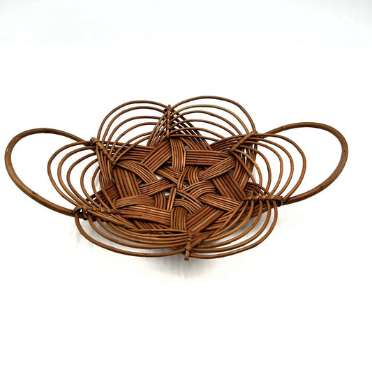 This is a vintage bread or fruit basket with a Celtic knot weave pattern. 
It is a decorative wicker or willow basket often used for serving bread or fruit.
