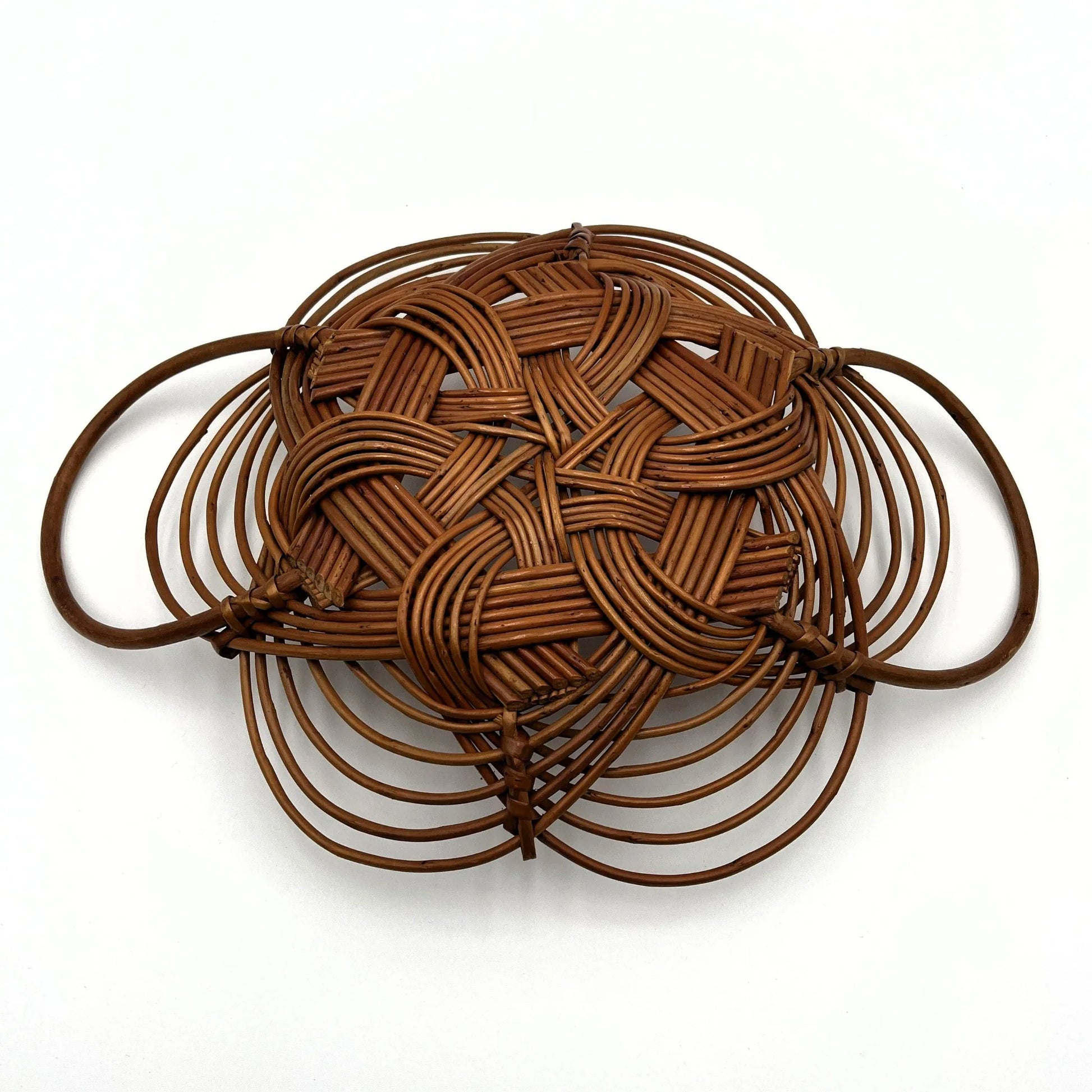 This is a vintage bread or fruit basket with a Celtic knot weave pattern. 
It is a decorative wicker or willow basket often used for serving bread or fruit.
