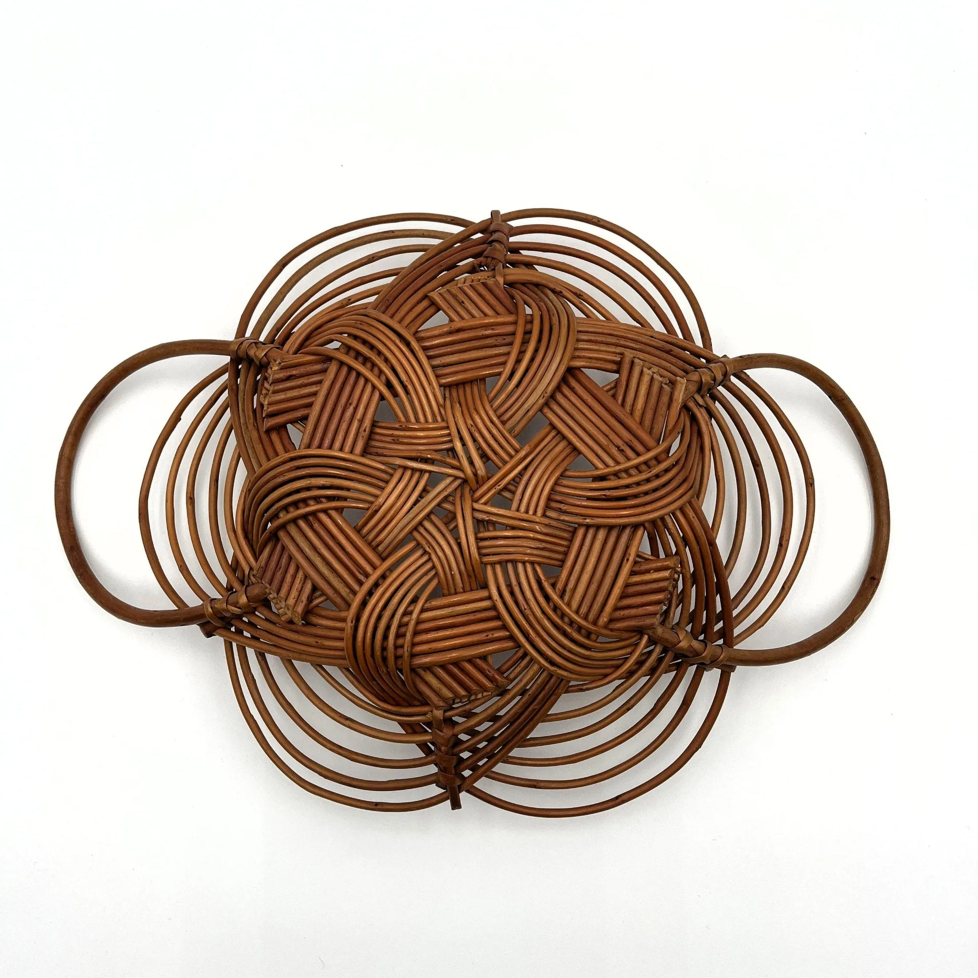 This is a vintage bread or fruit basket with a Celtic knot weave pattern. 
It is a decorative wicker or willow basket often used for serving bread or fruit.
