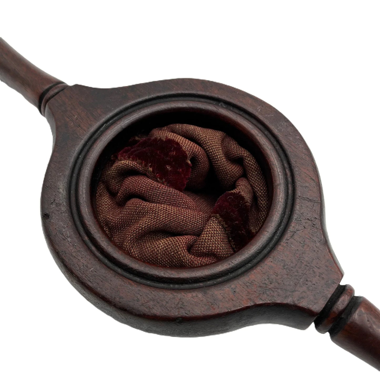 This is an antique wooden-handled church offering or collection velvet bag. These historical items were used in churches to collect tithes and donations from the congregation. 