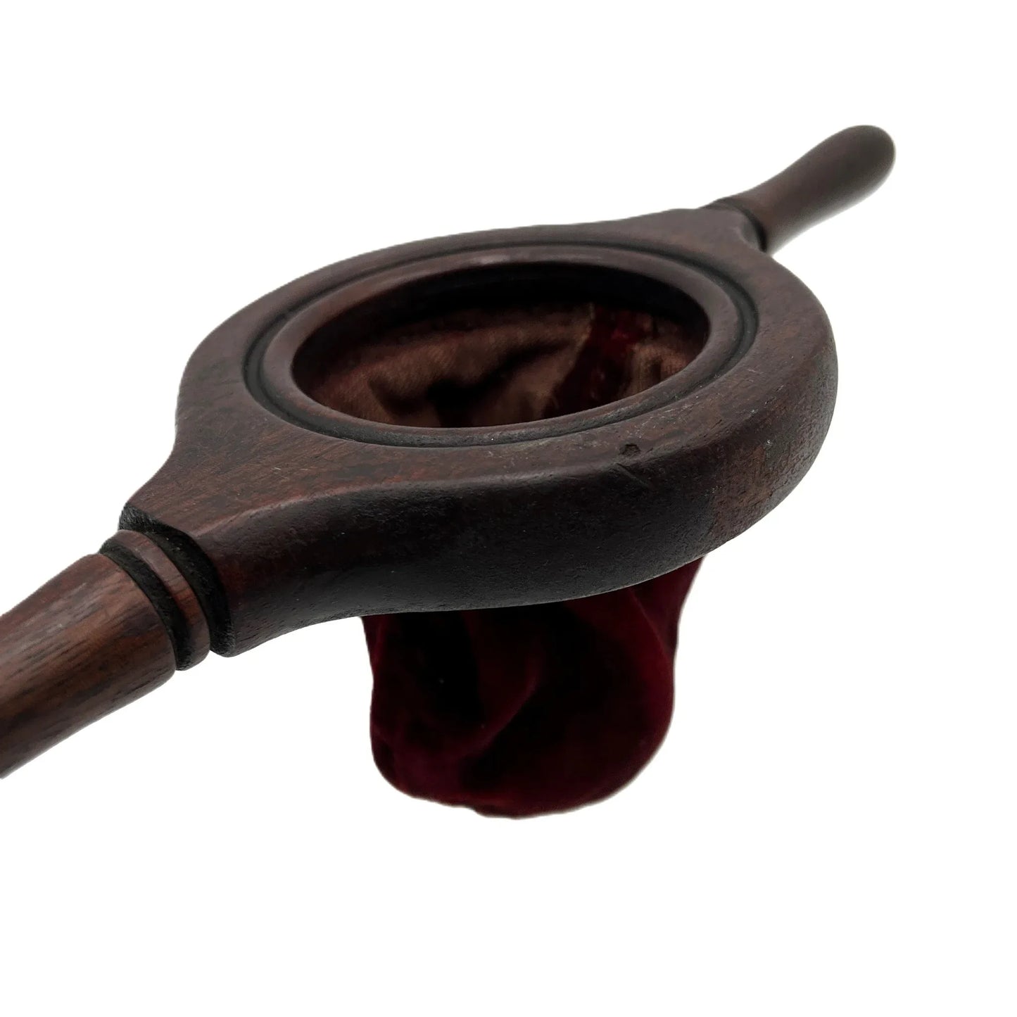 This is an antique wooden-handled church offering or collection velvet bag. These historical items were used in churches to collect tithes and donations from the congregation. 
