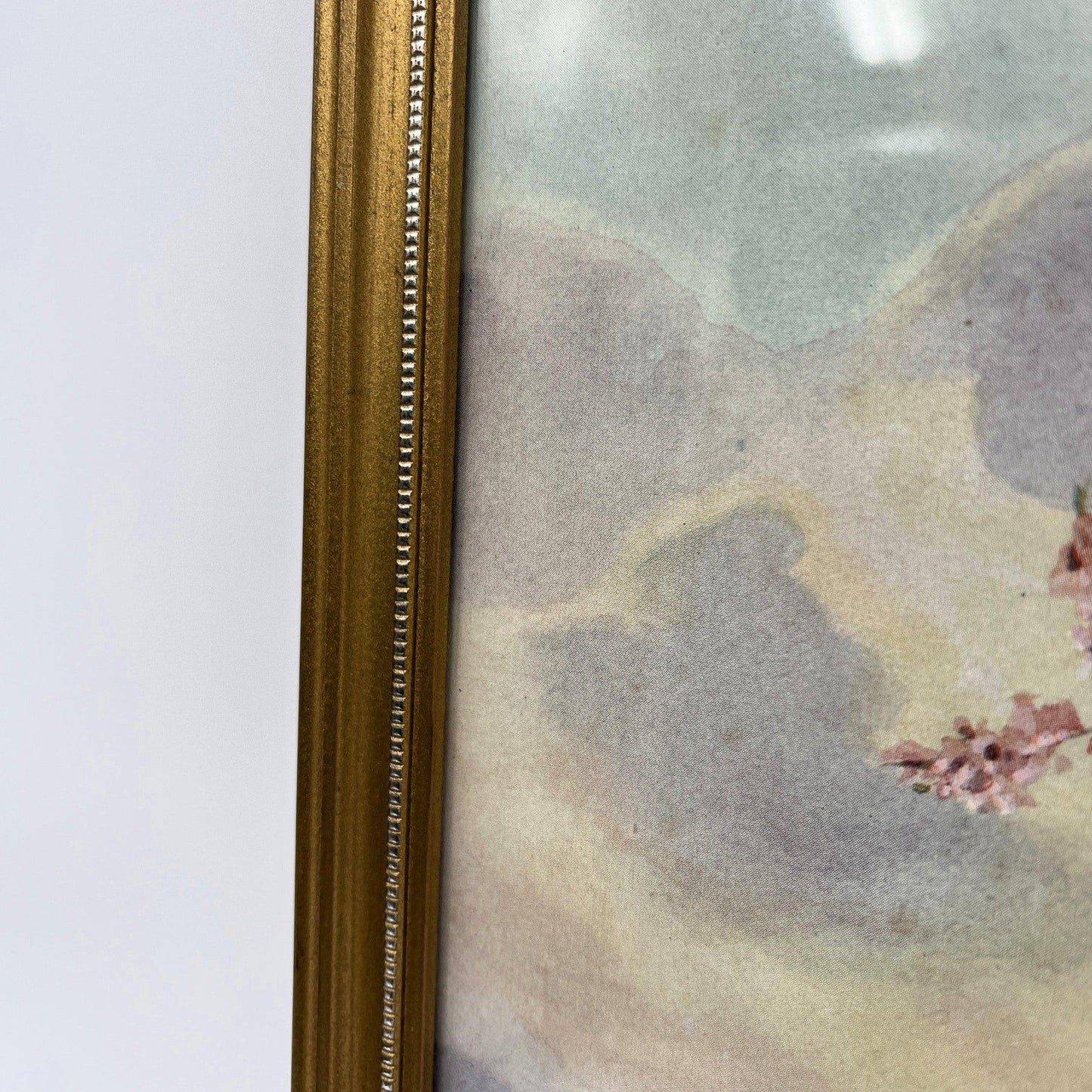 This is a framed print of the painting "Morning Carol" by the British illustrator Margaret Tarrant (1888-1959). The artwork depicts a child holding a rabbit, surrounded by other rabbits and birds under a blossoming tree, in a pastoral setting. 