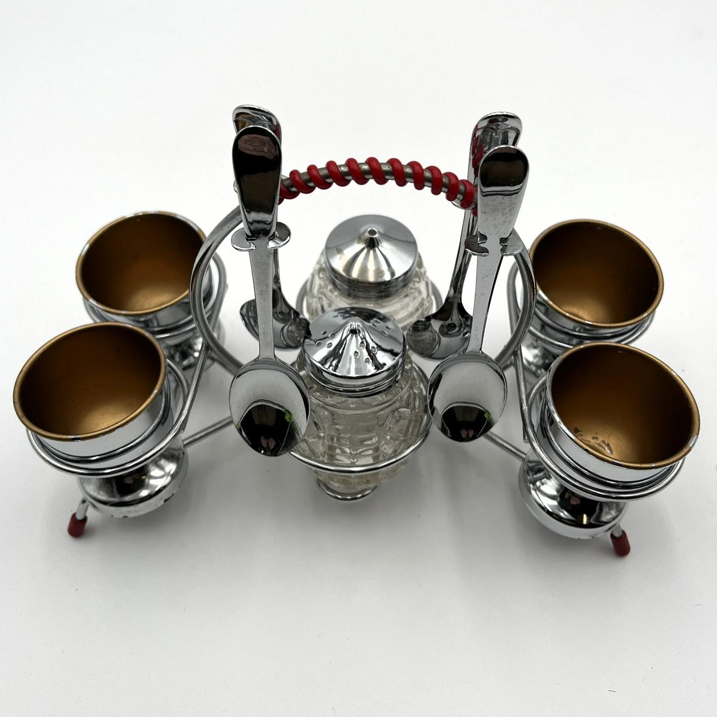 vintage 1960s egg cup holder with 4 egg cups, Salt and Pepper pots and 4 spoons. 