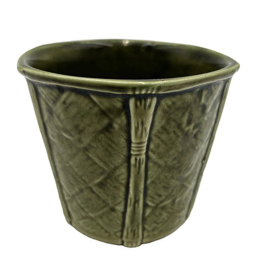This is a vintage rich forest green rounded hexagonal shaped ceramic planter made by Churchill England. Typically featuring a bamboo and basket-weave or woven texture design, these planters were manufactured in the mid-20th century, often cited as the 1950s to 1980s
